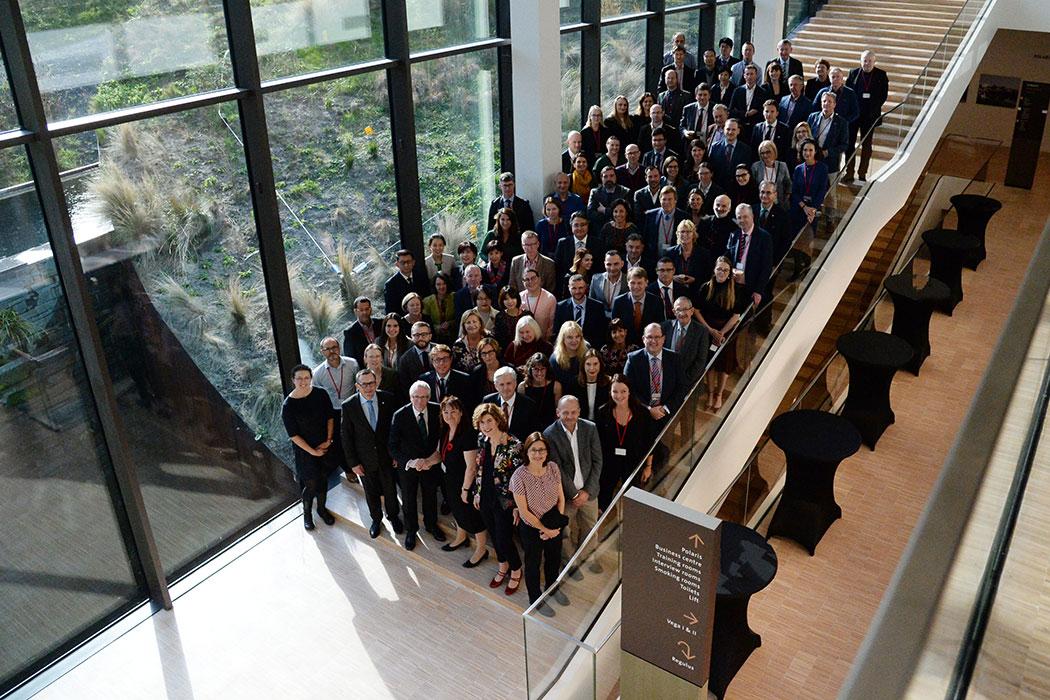 Group photo of conference delegates on venue stairs